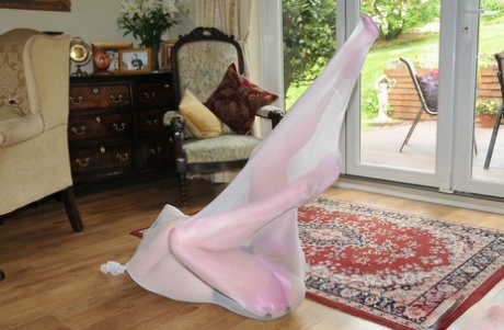 Caucasian female masturbates with a sex toy while encased in a nylon body bag 22327616