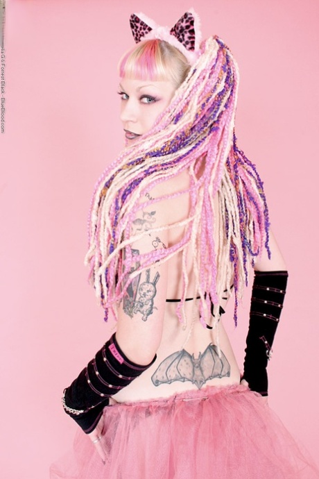 Alternative girl Chaotica takes off her bikini top during a solo performance 58821580