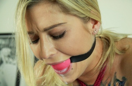 Tattooed blonde Kleio Valentien drools while riding a Sybian while ball gagged 41465323