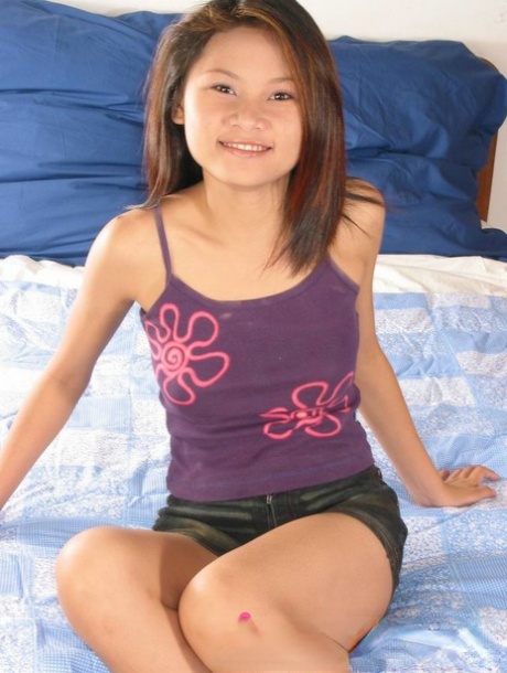 Petite Filipina teen uncovers her big tits while getting naked to masturbate 51011155