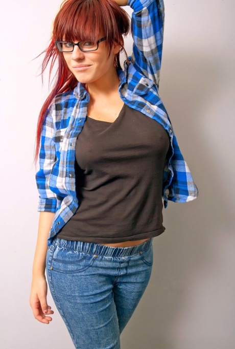 Redheaded nerd exposes her nice melons after donning micro skirt in glasses 52656759