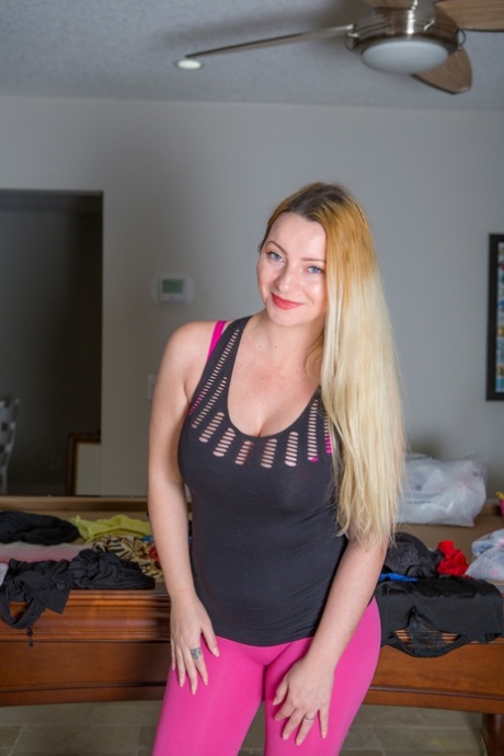 Blond girl Leyla Moore peels off pink leggings as she embarks on getting naked 55016364