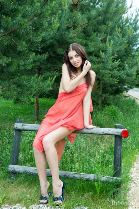 Beautiful teen girl Evita Lima models naked on a country road 42210121