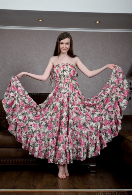 Russian solo girl Emily Bloom frees her shaved vagina from her long dress 21534346