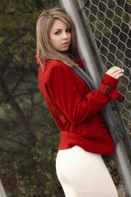 Pretty blonde Aspen Martin gets naked against a chain-link fence 67537640