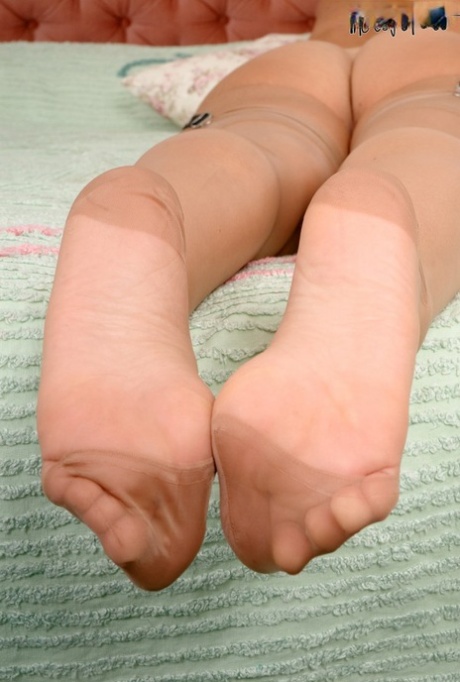 Slutty Tammy Lee in garter and sheer pantyhose showing off her sexy feet 71606648