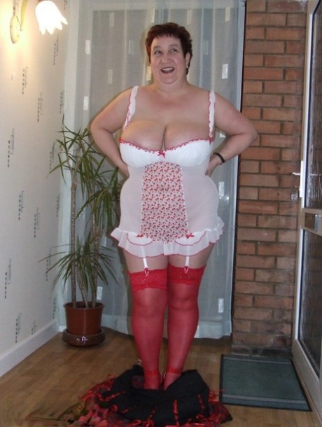 Fat amateur with short hair Kinky Carol exposes her huge tits in red nylons 14694549