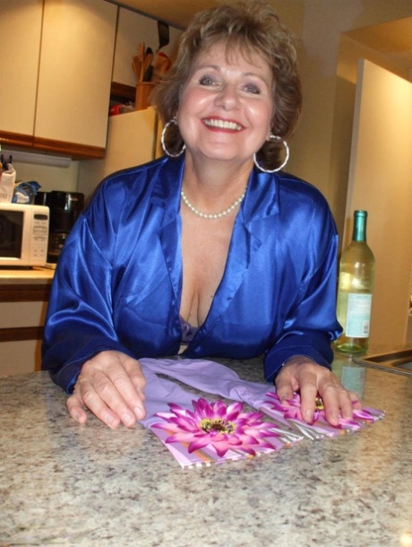 Older lady Busty Bliss goes topless in latex gloves before playing with a cock 32494960