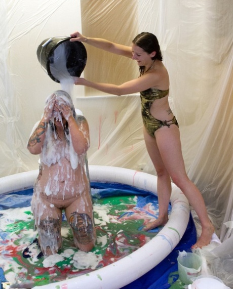Amateur lesbians douse each other in gunk while in a wading pool 61999157