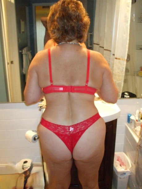 Older lady Busty Bliss licks her lips while exposing her big naturals 40376308