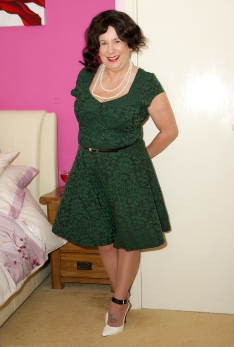 Mature UK amateur Speedy Bee doffs a dress before masturbating in tan nylons 21643633