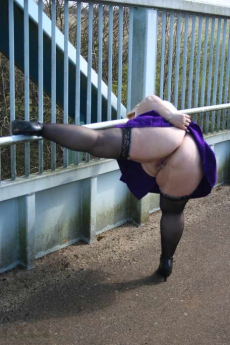 Obese British amateur Lexie Cummings takes a piss before crossing a footbridge 39260996