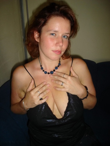 Plump redhead Luscious Models sets her sagging breasts loose from clothing 55824038