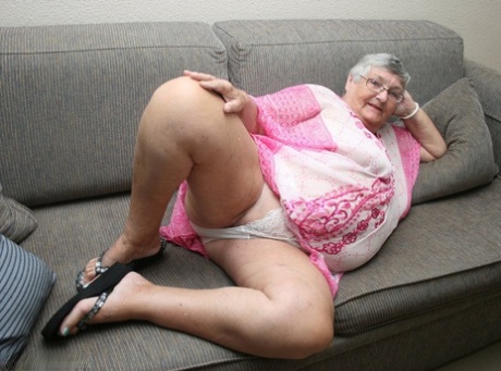 Horny Grandma Libby strips and spreads her old shaved pussy on the sofa 76567943