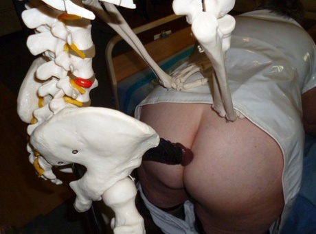 Fat old nurse Grandma Libby attaches a dildo to a skeleton for sexual relief 89405339
