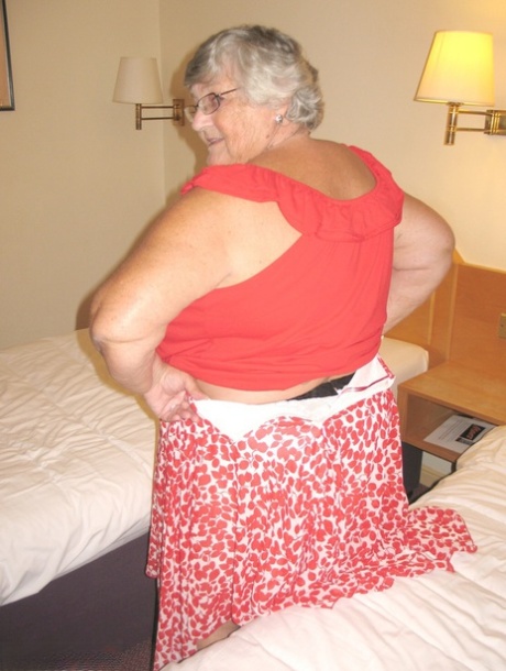 Fat British lady Grandma Libby toys her pussy on a bed in nylons and garters 98708834