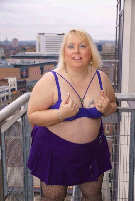 Older British BBW Lexie Cummings exposes her fat ass and twat on a balcony