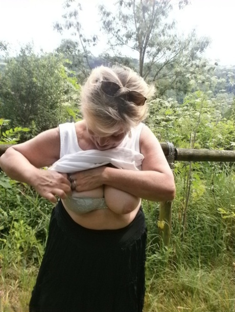 Mature amateur whore Caro masturbating on the bench in the woods 64448674
