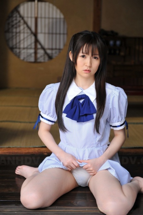 Japanese cutie Ai Uehara sits on the balcony and reveals her unshaved vagina 97812440