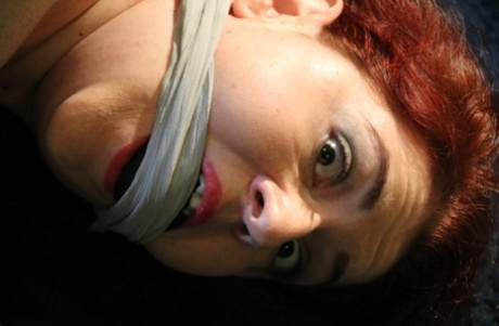 Overweight redhead Mada Rose is left alone while hogtied and cleave gagged 86890135