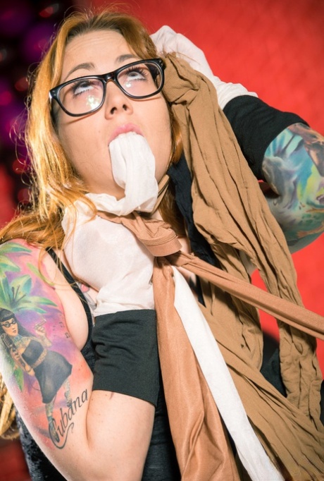 Tattooed girl Foxy Sanie masturbates while layered in shiny hosiery 11669076