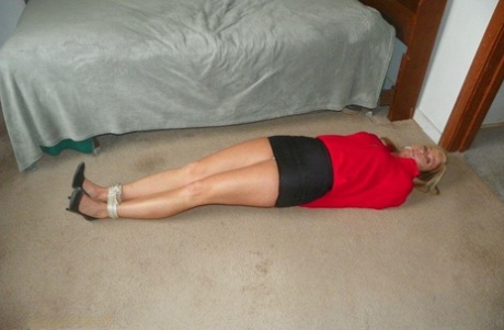 Blonde female ends up hogtied on a bed while cleave gagged in her clothes 76702208