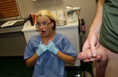 Blonde nurse in latex gloves jerks on a man's dick while examining his balls 57106069