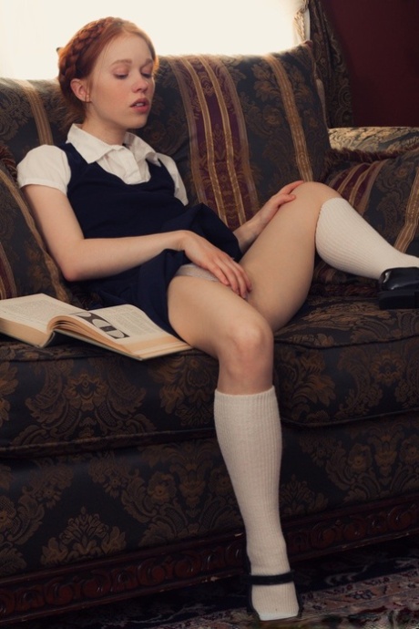Young looking redhead Dolly Little gets naked in white socks and Mary Jane's 22180061