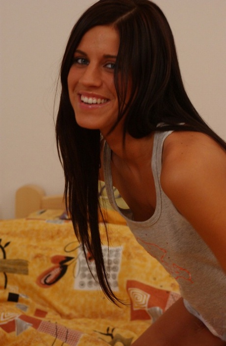 Beautiful brunette teen Maxine masturbates on a bed with a gold of vibrator 49216120