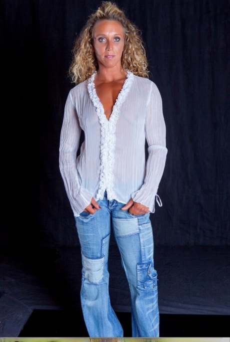 Blonde bodybuilder with tiny tits flexes while topless in blue jeans 57498768