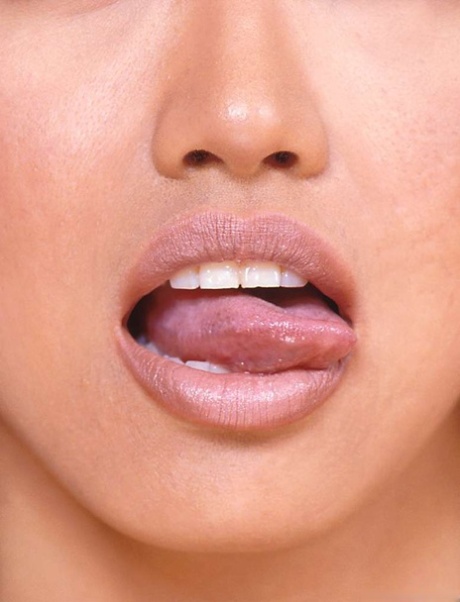 Petite Asian girl licks her lips before showing the pink of her trimmed muff 15006803