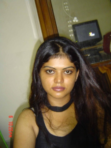 Indian woman Neha takes self shots while she holds her face firm 52567648