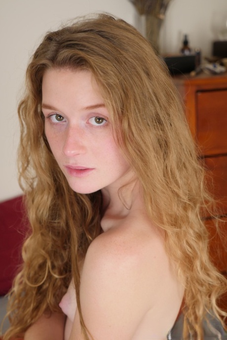 Pale redhead Karina Pontiac slips off her robe to model totally naked on bed 43090014