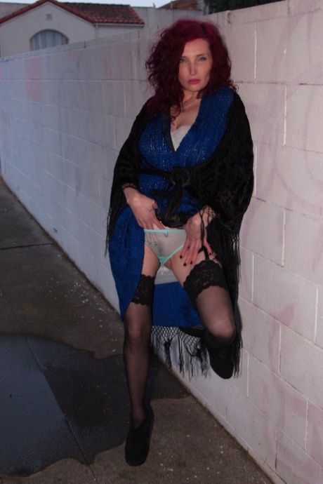 Mature lady with red hair Zinnia Blue masturbates in black stockings 99879062