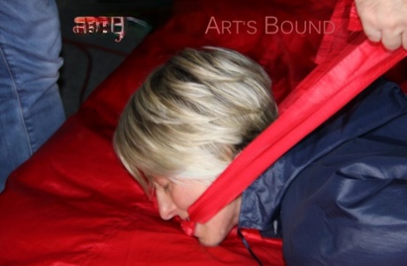 Barefoot blonde is left hogtied and gagged in nylon clothing 48260720