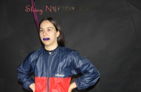 Caucasian girl is restrained in a nylon rain suit before being gagged 48671944