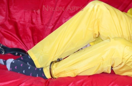White girl is restrained with cuffs and chain while gagged in nylon attire 99485226