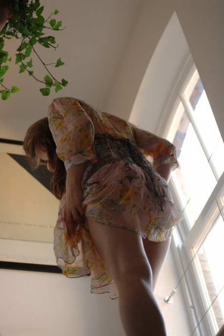 Beautiful tomboy Fuzen gets completely naked next to a window on a landing 71676355