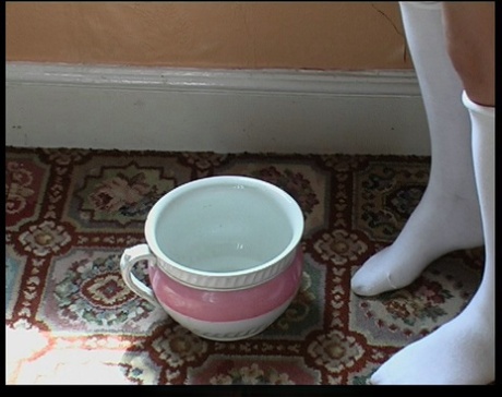 Caucasian students hold piss pots before being caned by an older man 28123340