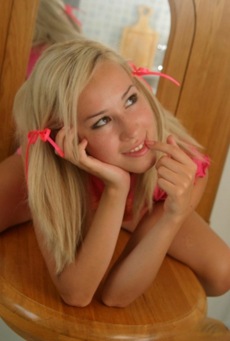 Young blonde wears her hair in pigtails for her nude debut 71741015