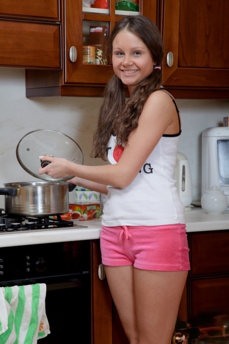 Young looking girl Liza Shay rides a big dildo while cooking something to eat 72769443