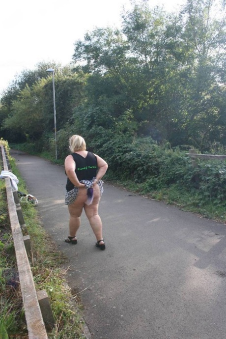 Overweight UK blonde Lexie Cummings shows her tail butt plug in the outdoors 64255756