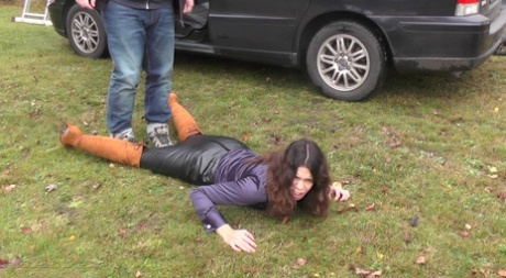 Brunette female is rendered unconscious before being loaded into a minivan 92617052