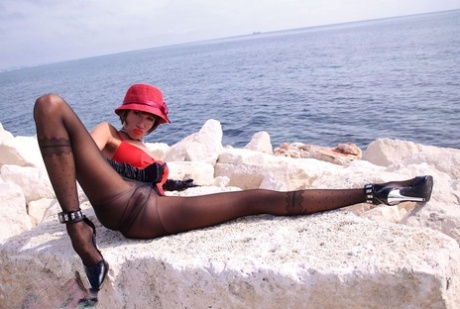 Classy lady spreads her legs wide open on a seaside cliff in pantyhose 83812182
