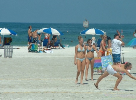 Candid non-nude action of girls in bikinis doing beach things 91574790