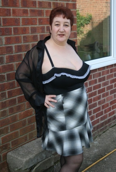 Mature redhead BBW Kinky Carol exposes her thong during outdoor upskirt action 28453844