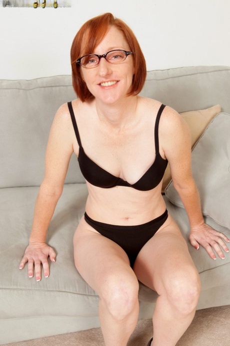 Older redhead Layla Redd takes off her jeans on way to posing nude 19172865