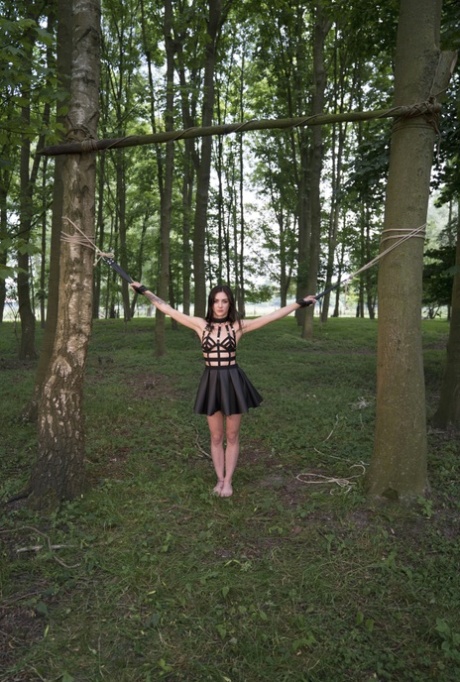 Naked brunette Lullu Gun endures as much pain as she can take in the woods 61544178