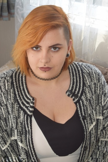 Fat redhead Phillipas Ladies stands naked after disrobing on a couch 38905062