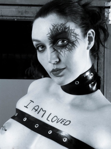 Tattooed model Dutch Dame is restrained with leather straps in platform heels 14462735
